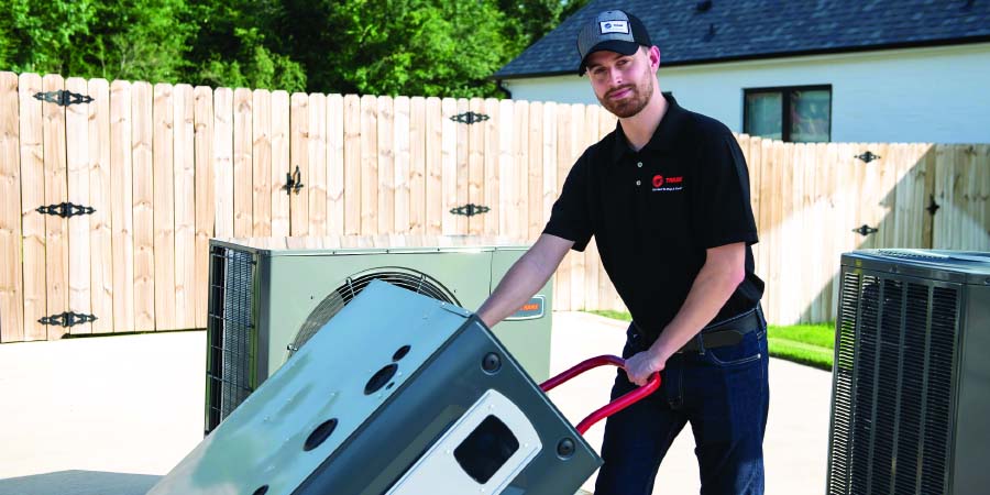 hvac tech wheeling in unit